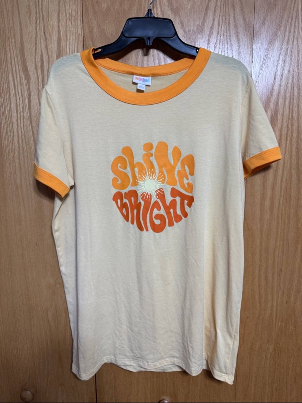 LuLaRoe Liv Yellow Ringer Tee with Orange Graphic